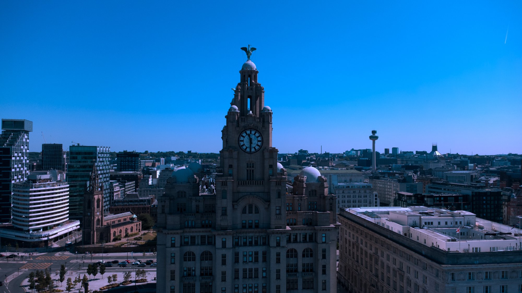 Aerial view of Liverpool skyline centred on the Royal Liver Building clock tower.